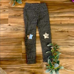 Gray sweatpants with stars on the knees